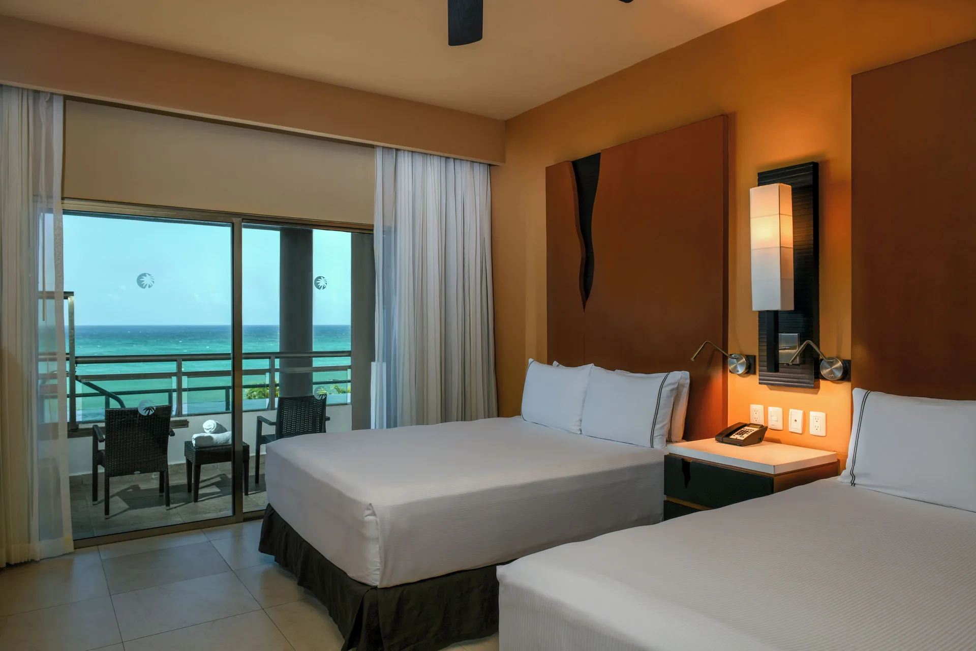 Oceanfront Swim Up Suite with two beds and balcony view at Generations Riviera Maya.