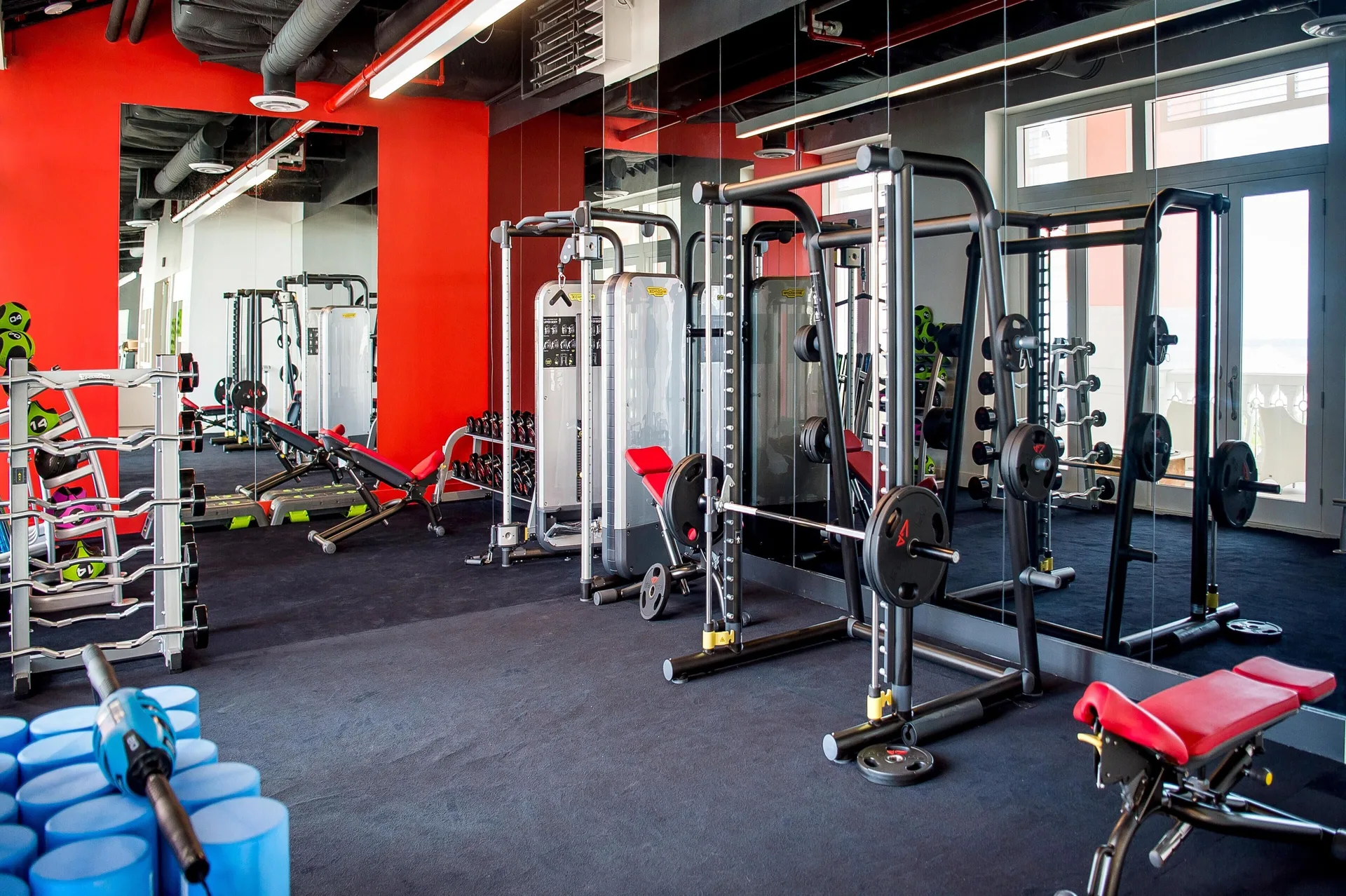 Strength training equipment and mirrors in the fitness center at Grand Hyatt Baha Mar.