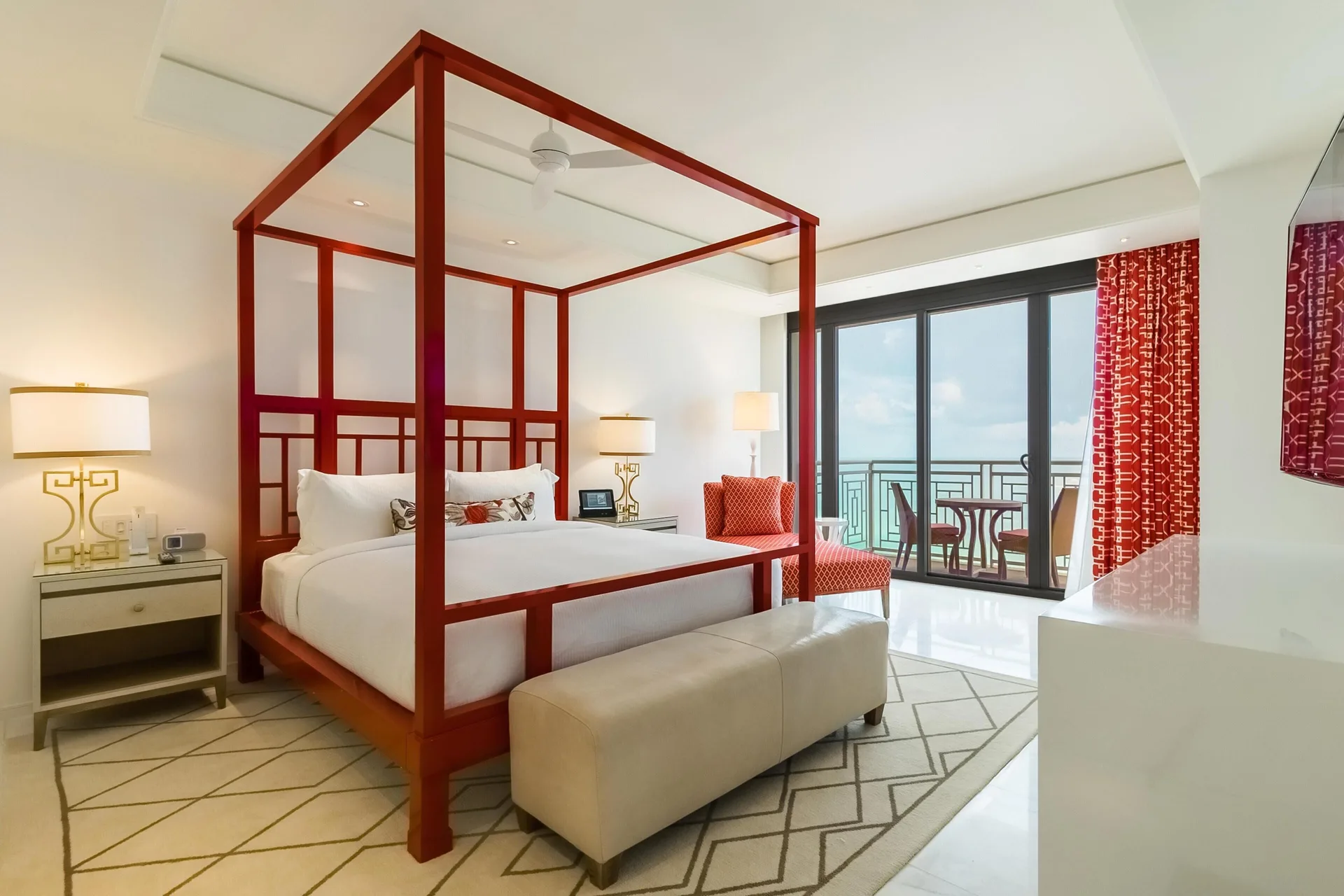 Four-poster king bed suite with ocean balcony at Grand Hyatt Baha Mar.