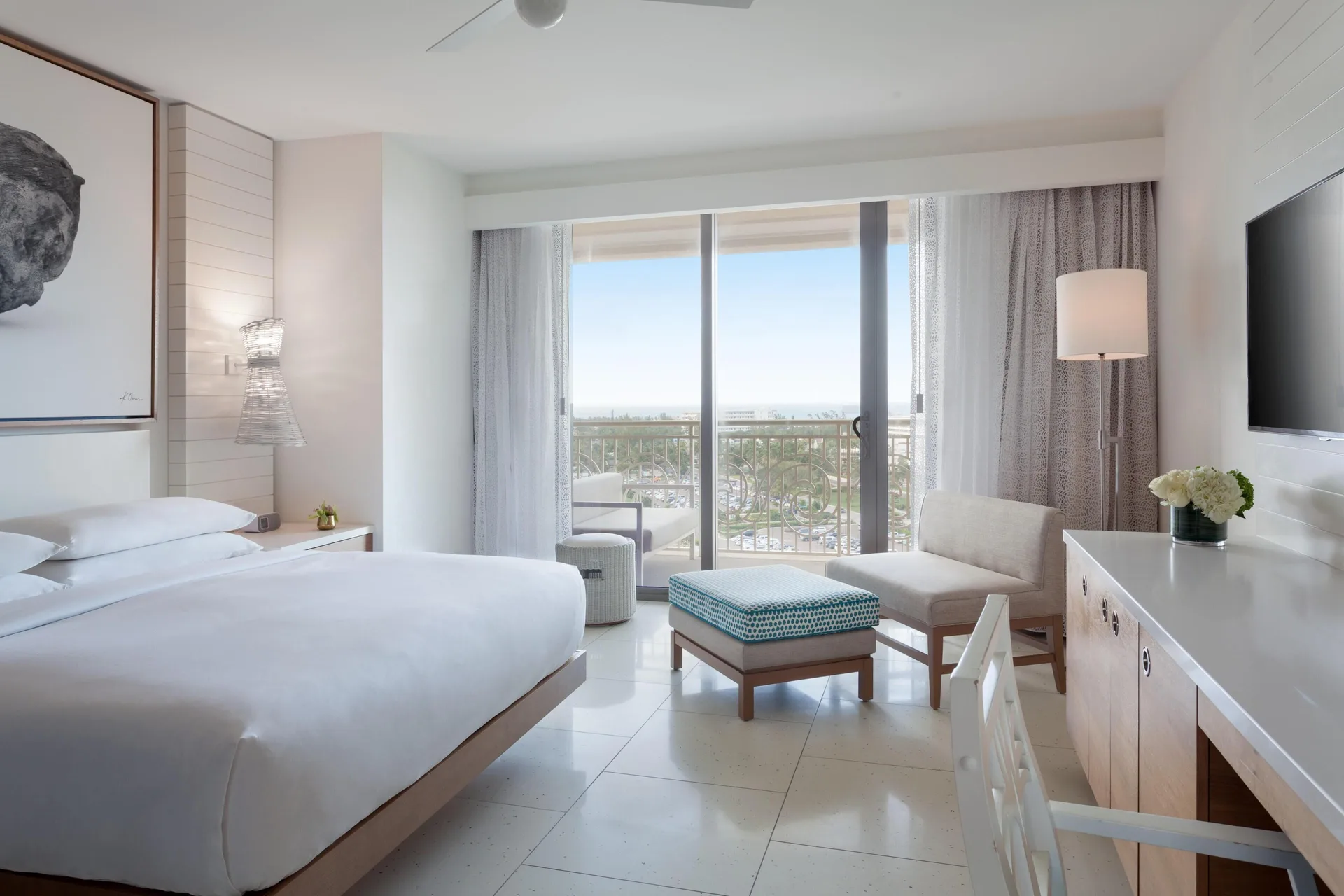 King guest room with balcony seating and ocean view at Grand Hyatt Baha Mar.
