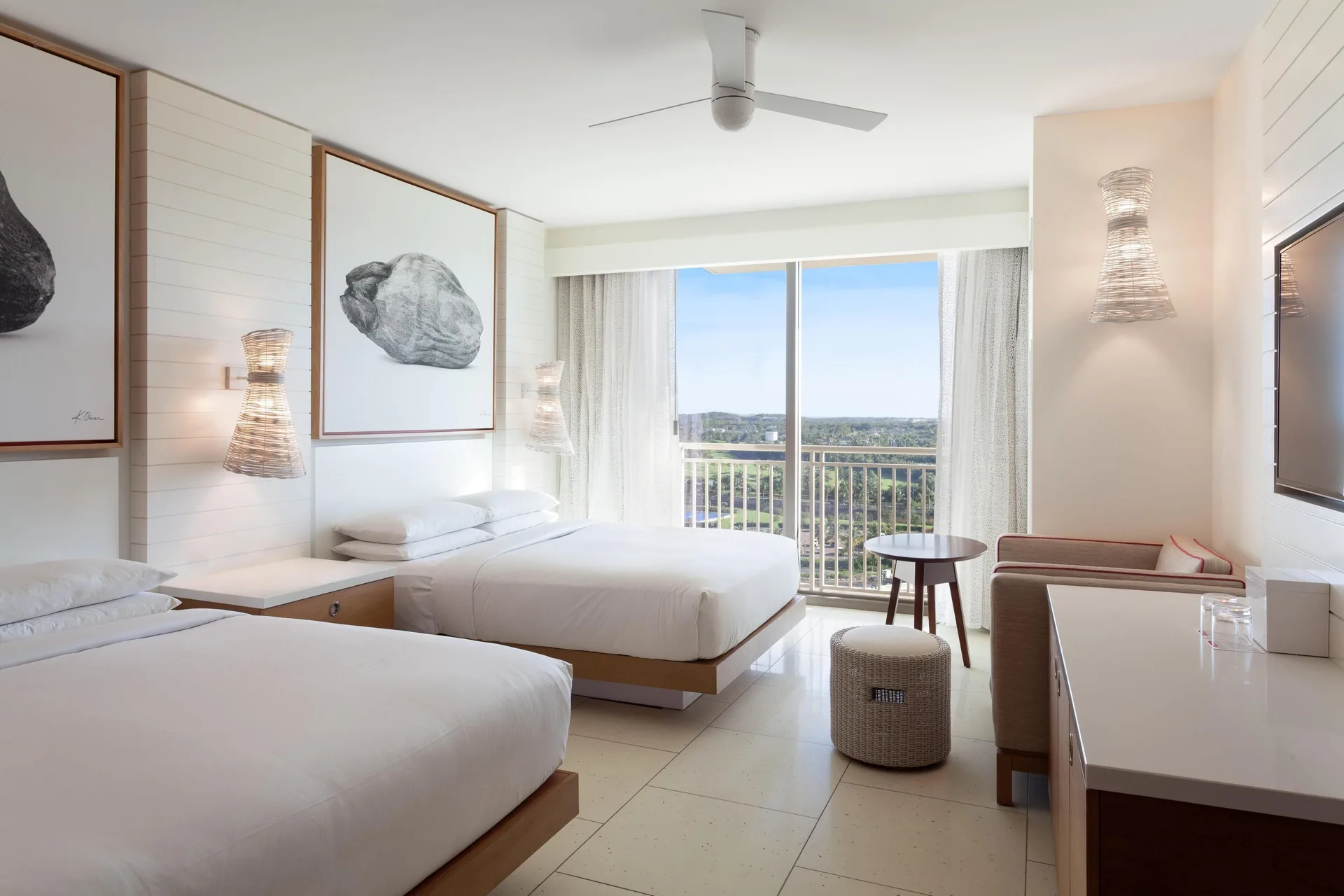 Two-bed guest room with balcony and resort view at Grand Hyatt Baha Mar.