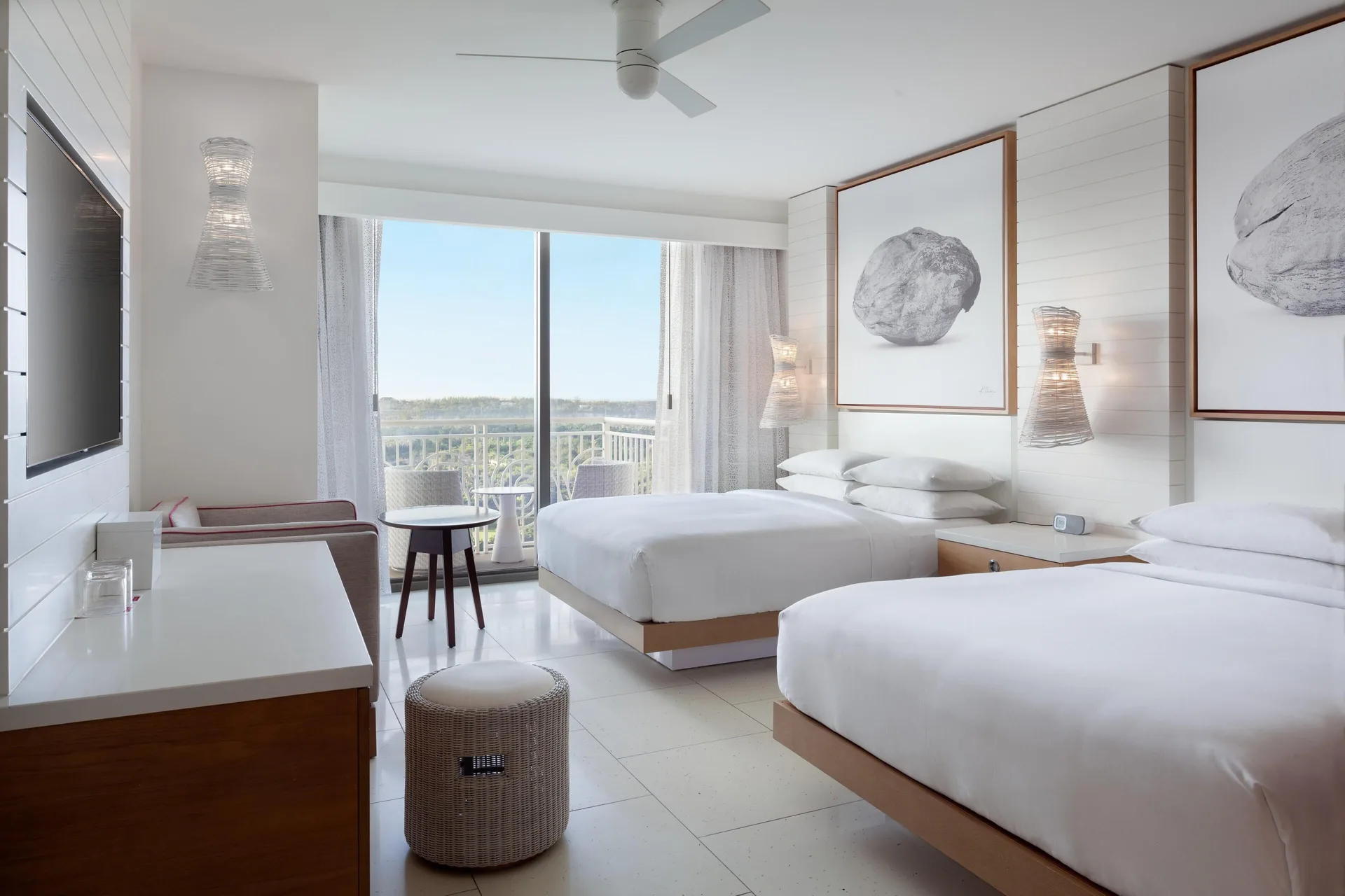 Two-bed guest room with balcony and seating at Grand Hyatt Baha Mar.