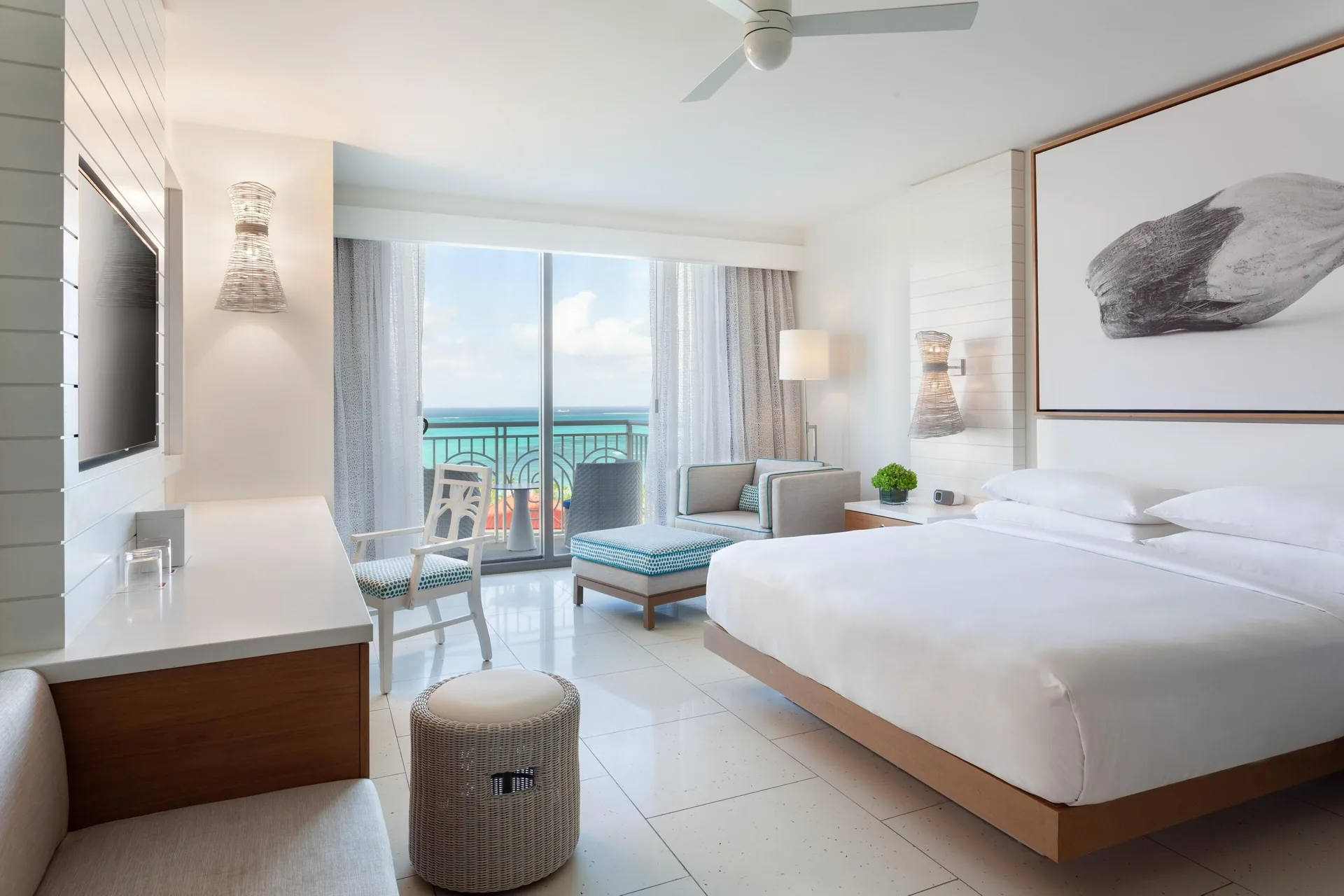 Ocean-view king guest room with balcony seating at Grand Hyatt Baha Mar.