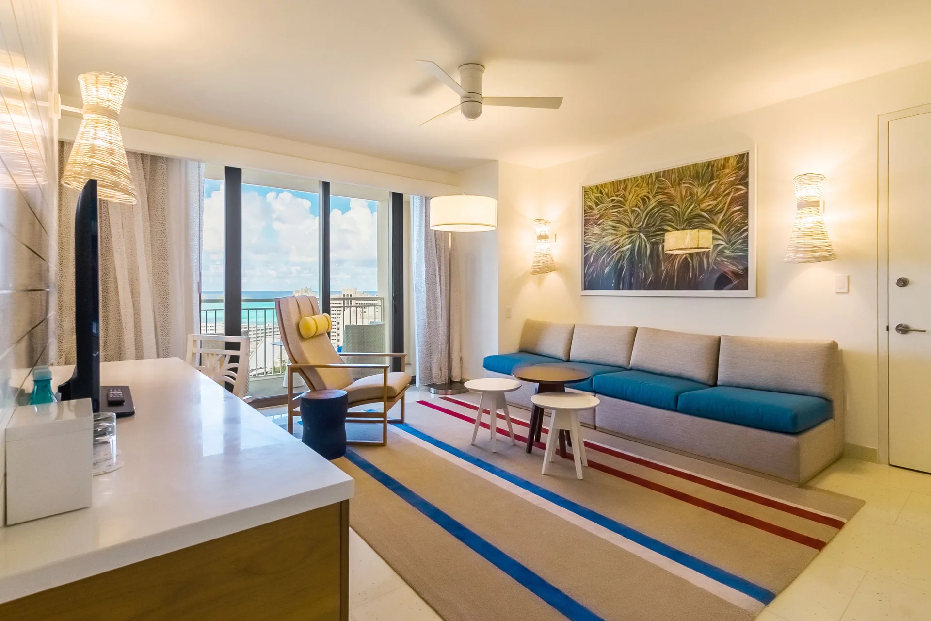 Suite living area with ocean-view balcony at Grand Hyatt Baha Mar.