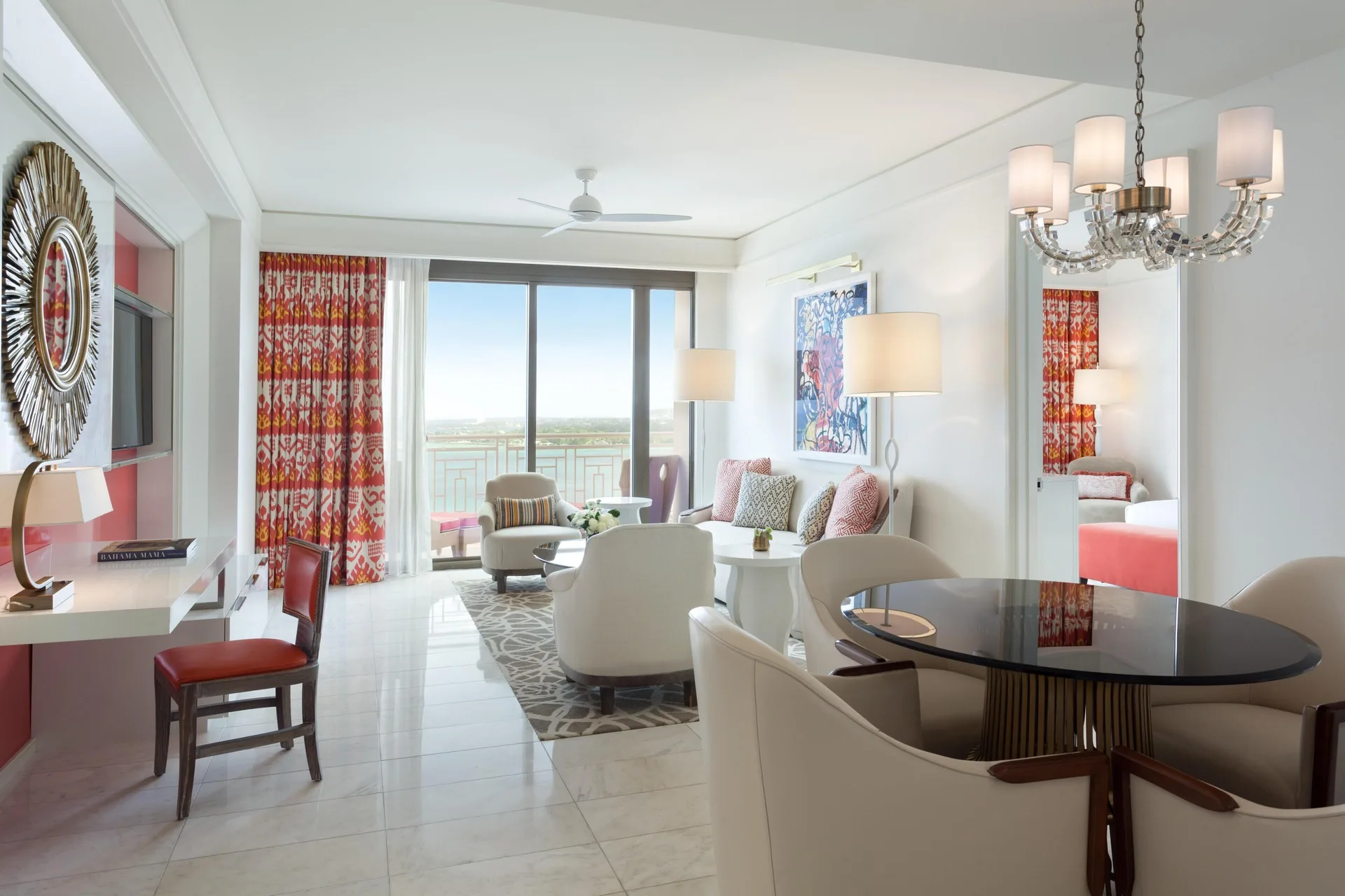 Deluxe one-bedroom residence living and dining area with balcony at Grand Hyatt Baha Mar.