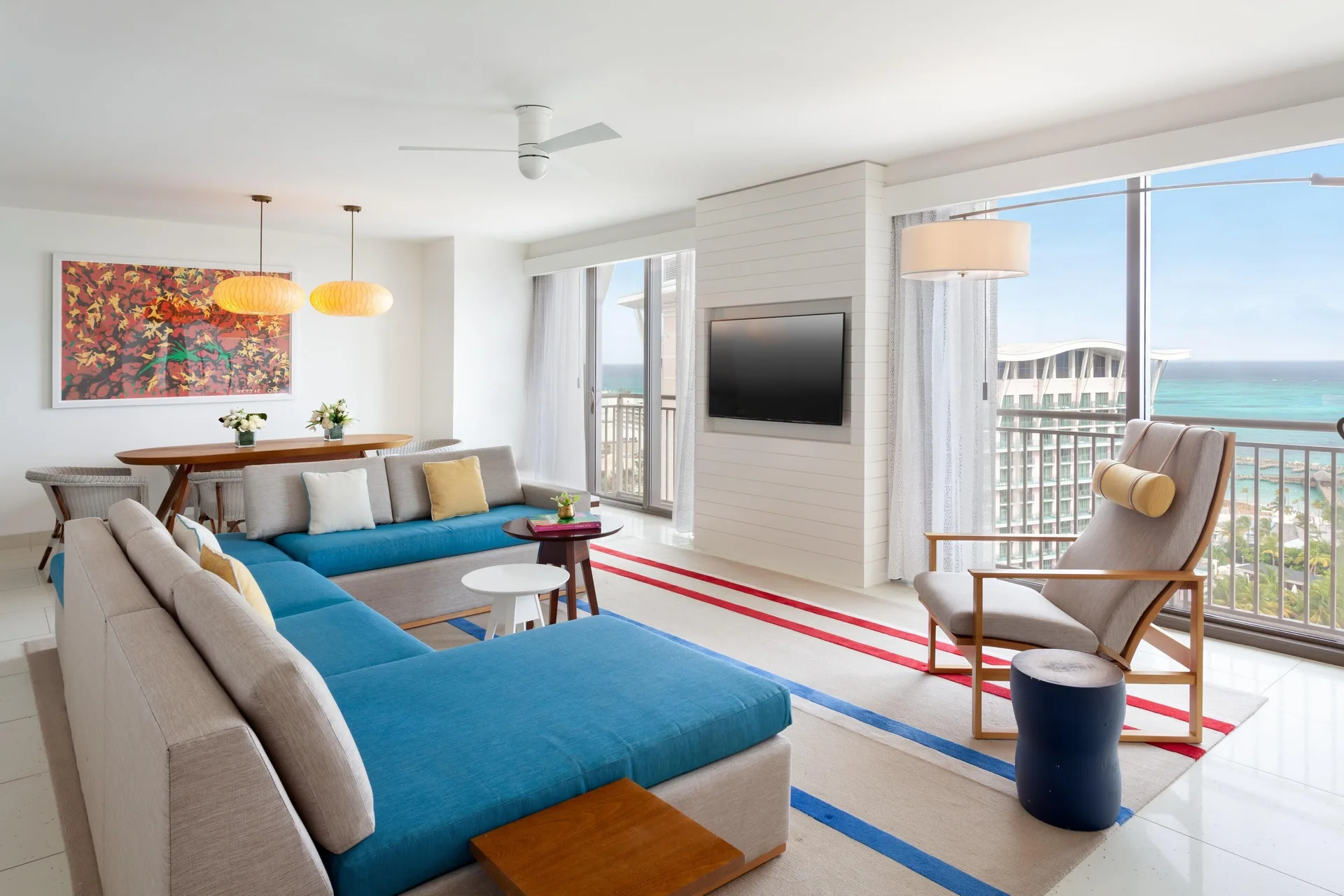 Ocean-view living and dining area in a Deluxe Room residence at Grand Hyatt Baha Mar.