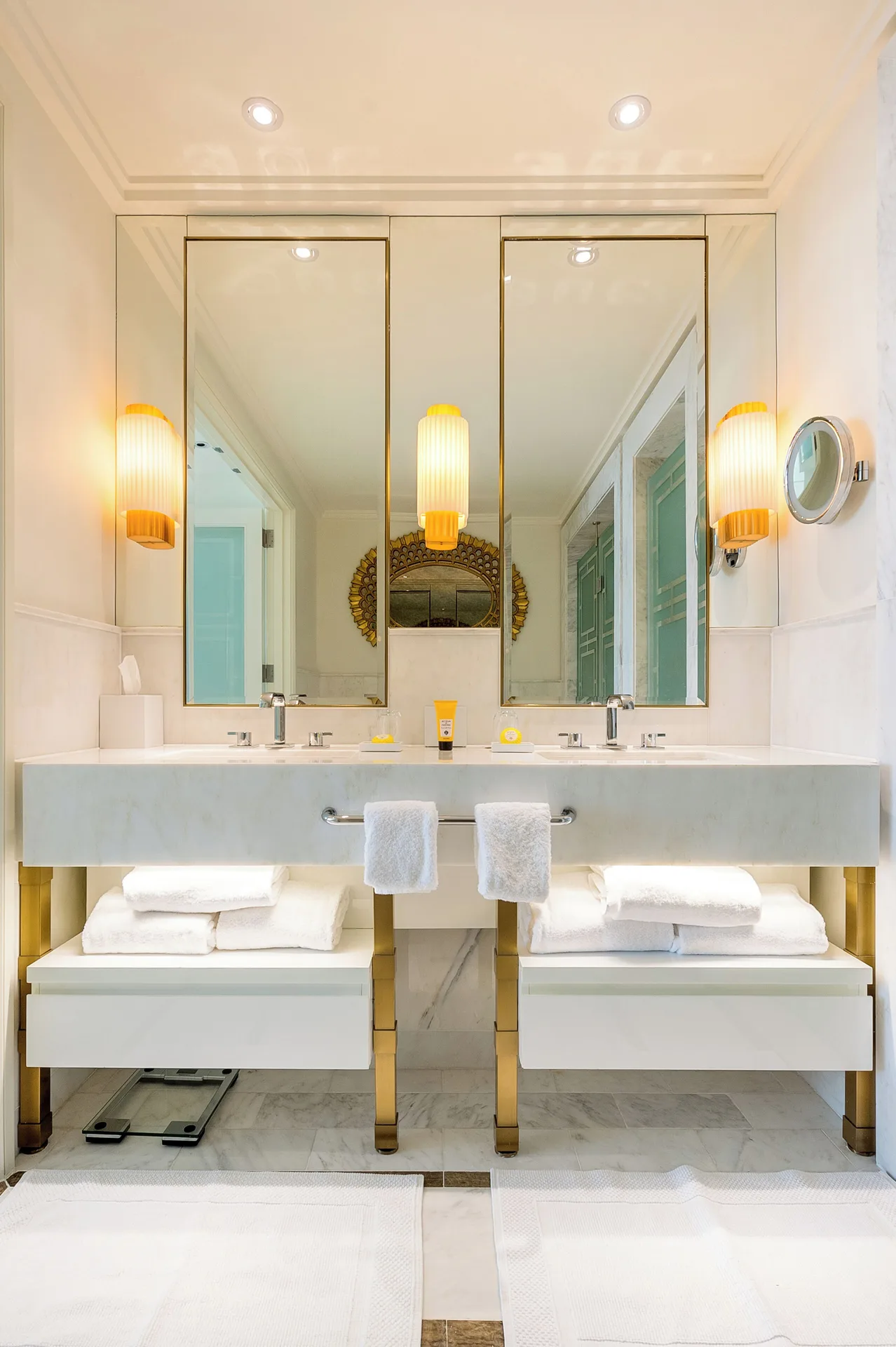 Double vanity bathroom with marble counter and mirrors at Grand Hyatt Baha Mar.
