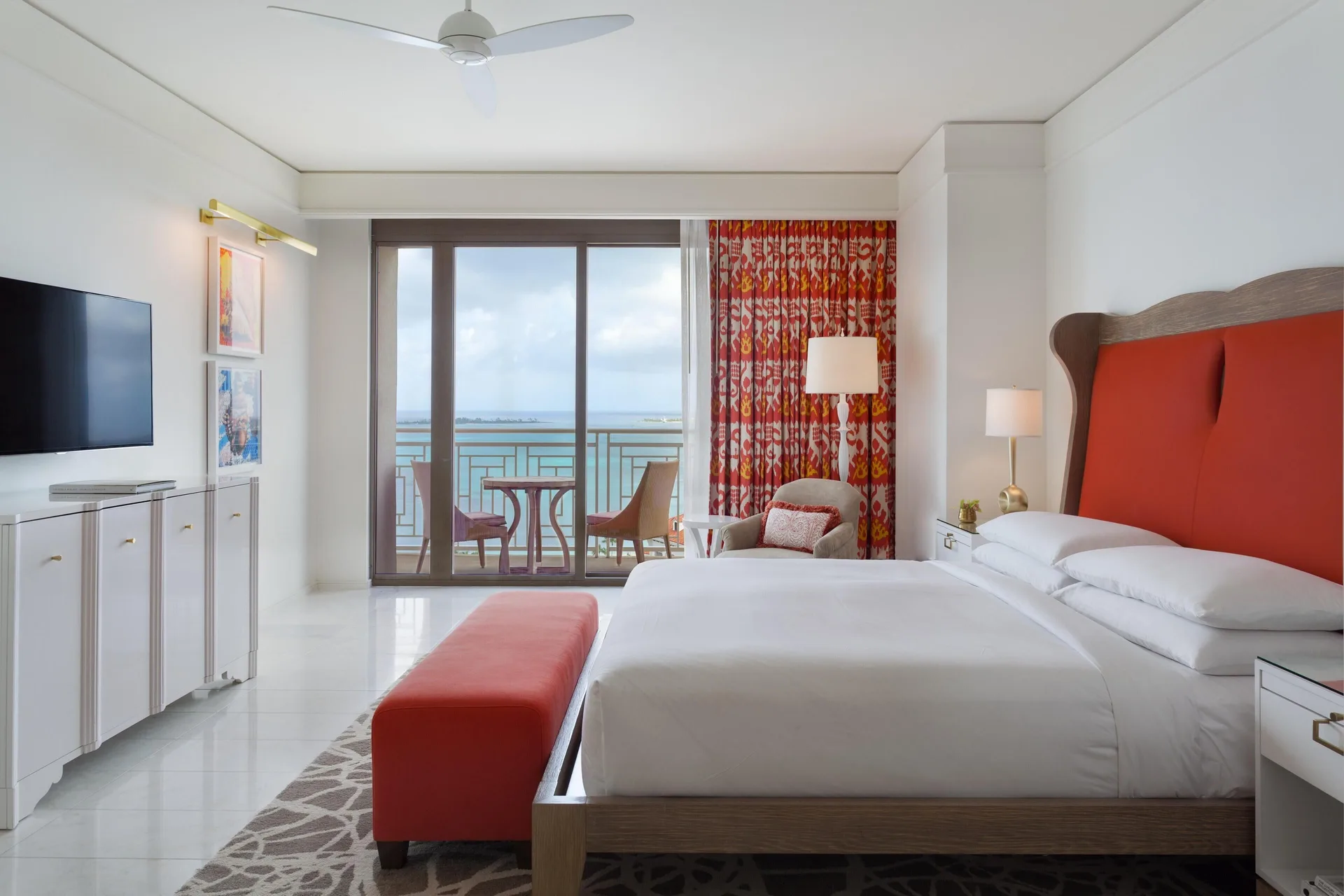 King bedroom with balcony seating and ocean view in a residence at Grand Hyatt Baha Mar.