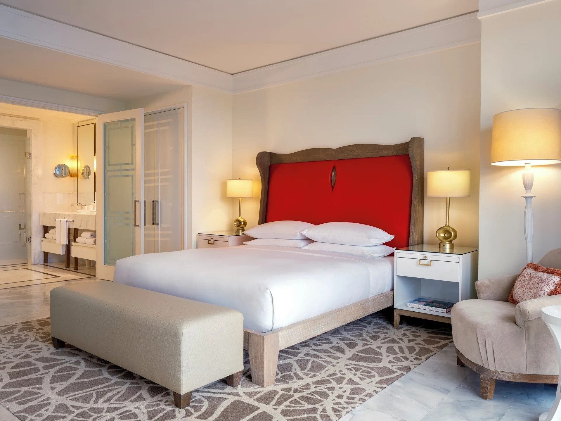 Bedroom with king bed and open marble bathroom in an ocean-view residence at Grand Hyatt Baha Mar.