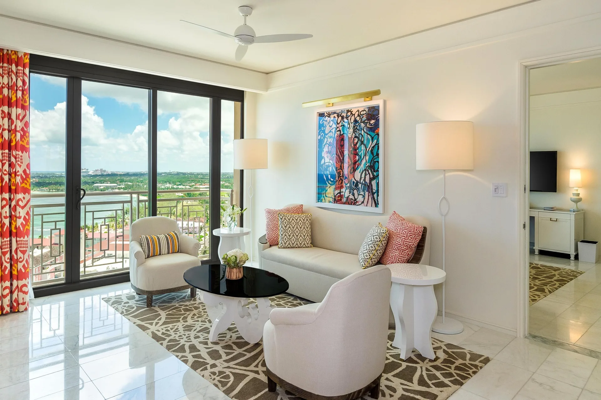 Living room with balcony doors and water view in an ocean-view residence at Grand Hyatt Baha Mar.