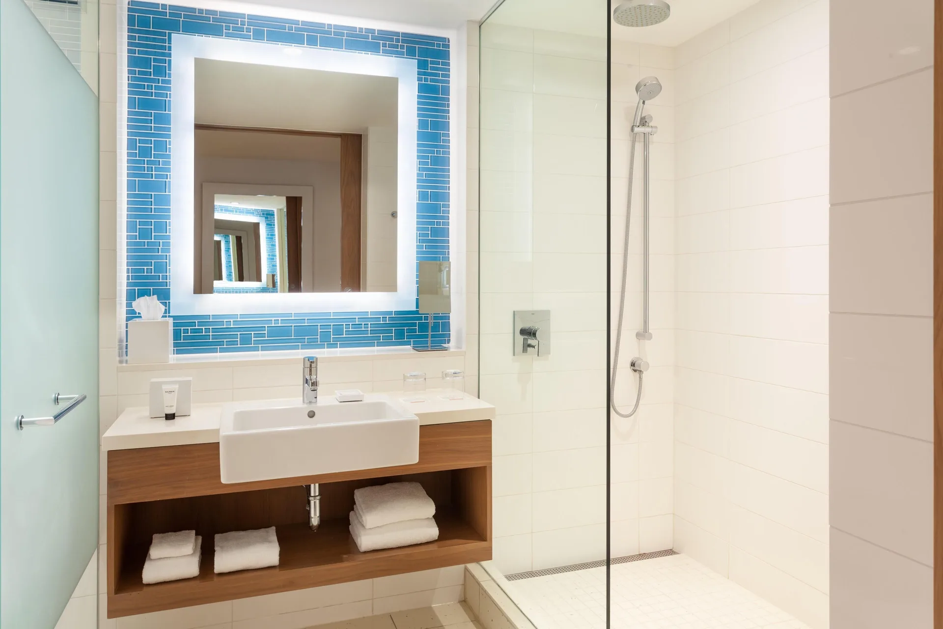 Bathroom vanity and glass shower in a residence at Grand Hyatt Baha Mar.