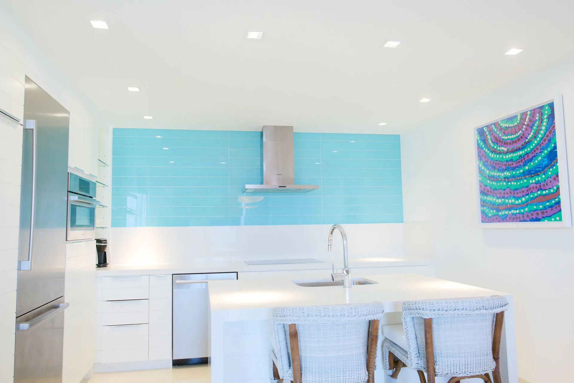 White residence kitchen with turquoise backsplash at Grand Hyatt Baha Mar.