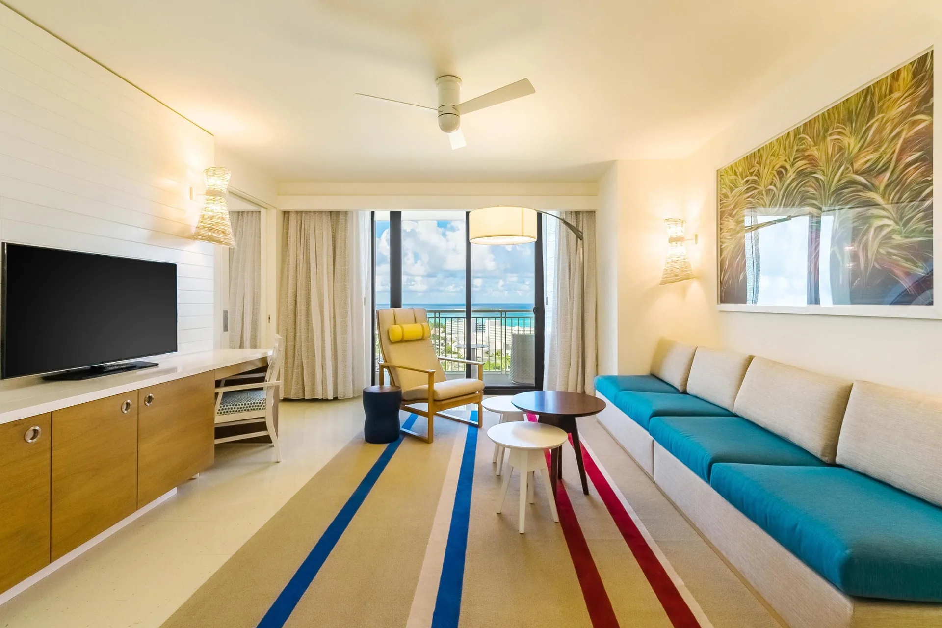 Ocean-view living room with sofa and balcony at Grand Hyatt Baha Mar.