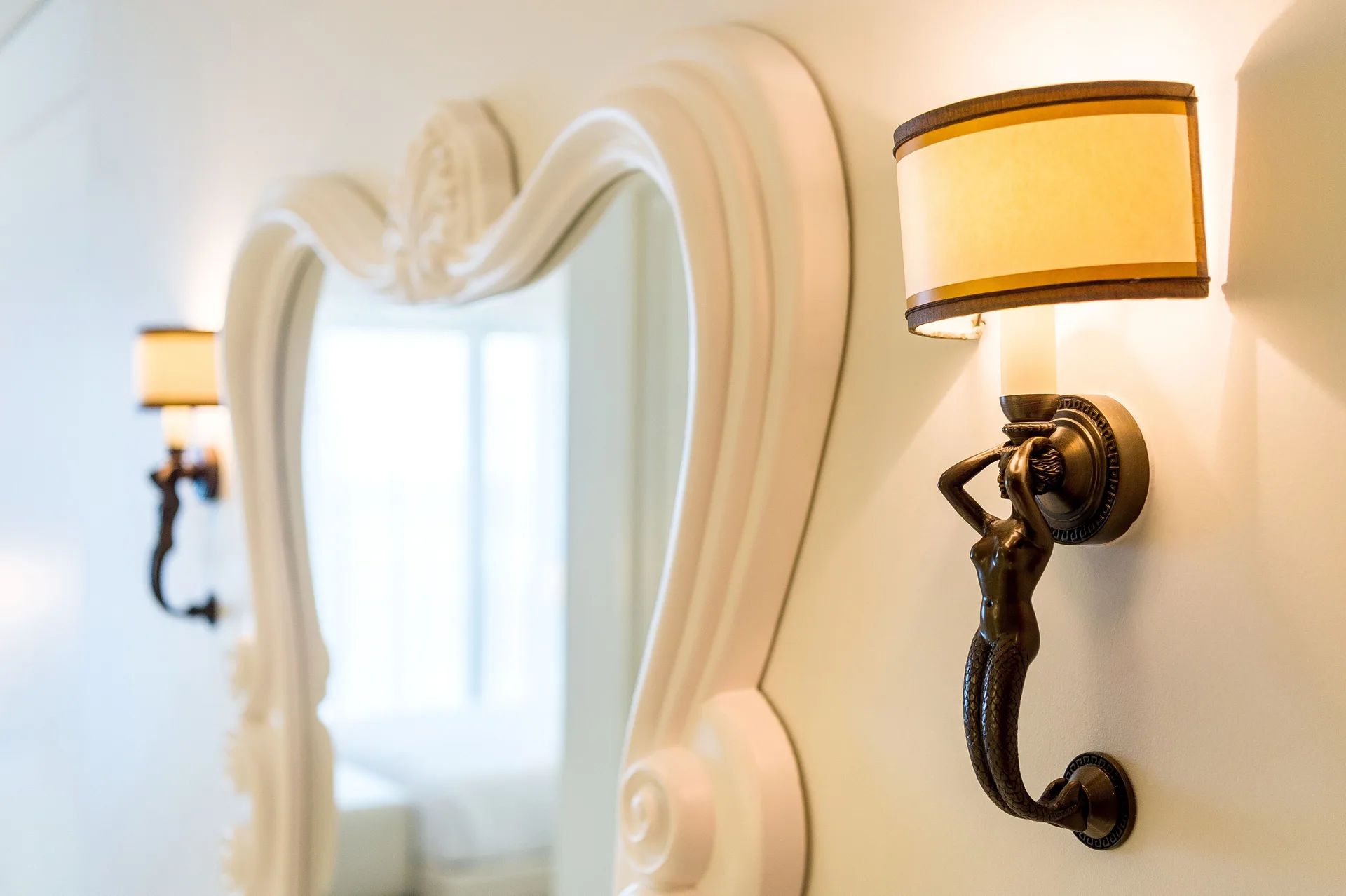 Decorative wall sconce and mirror detail in a residence room at Grand Hyatt Baha Mar.