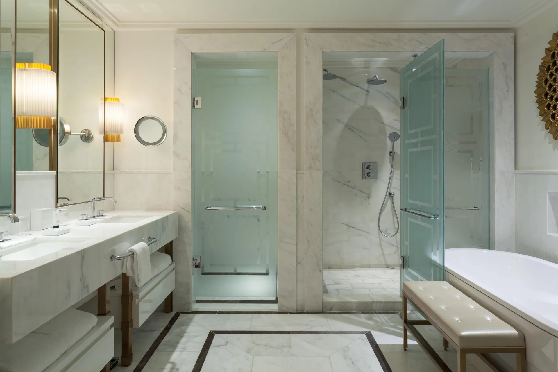 Marble bathroom with double vanity, shower, and tub at Grand Hyatt Baha Mar.