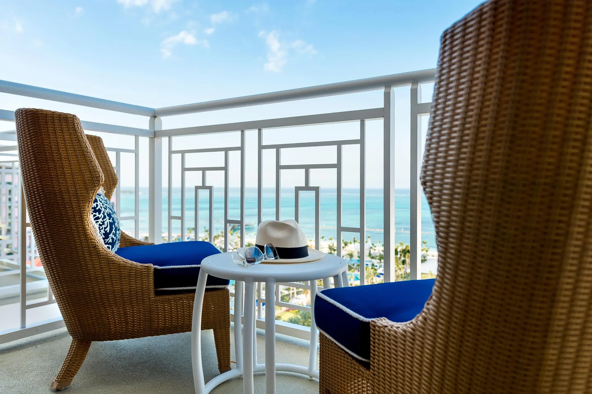 Ocean view balcony with wicker chairs at Grand Hyatt Baha Mar.