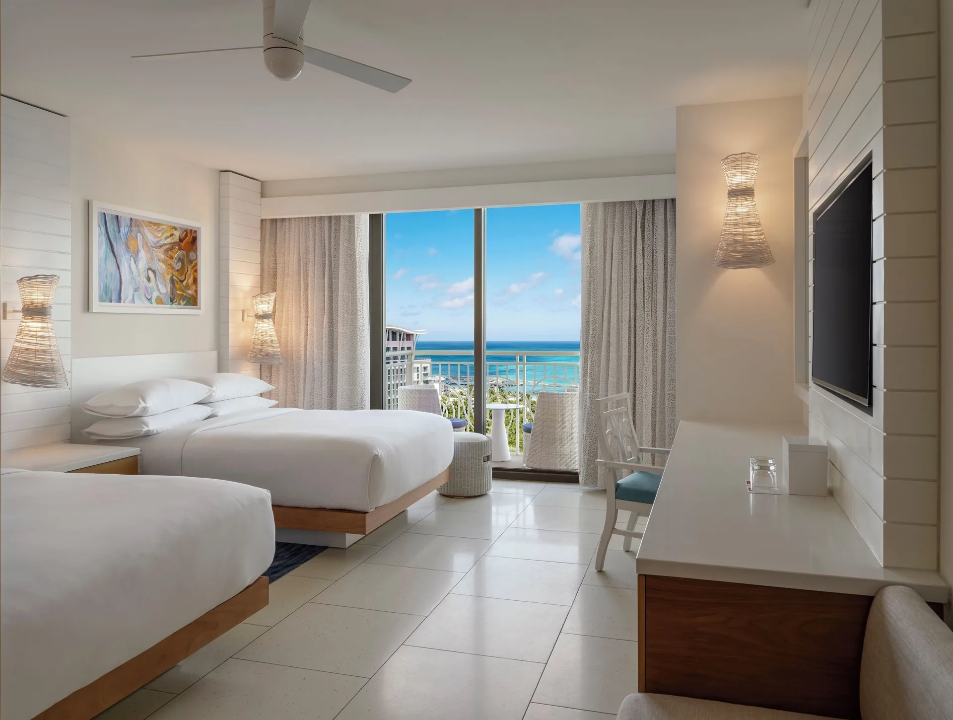 Two-bed ocean view guest room with balcony at Grand Hyatt Baha Mar.
