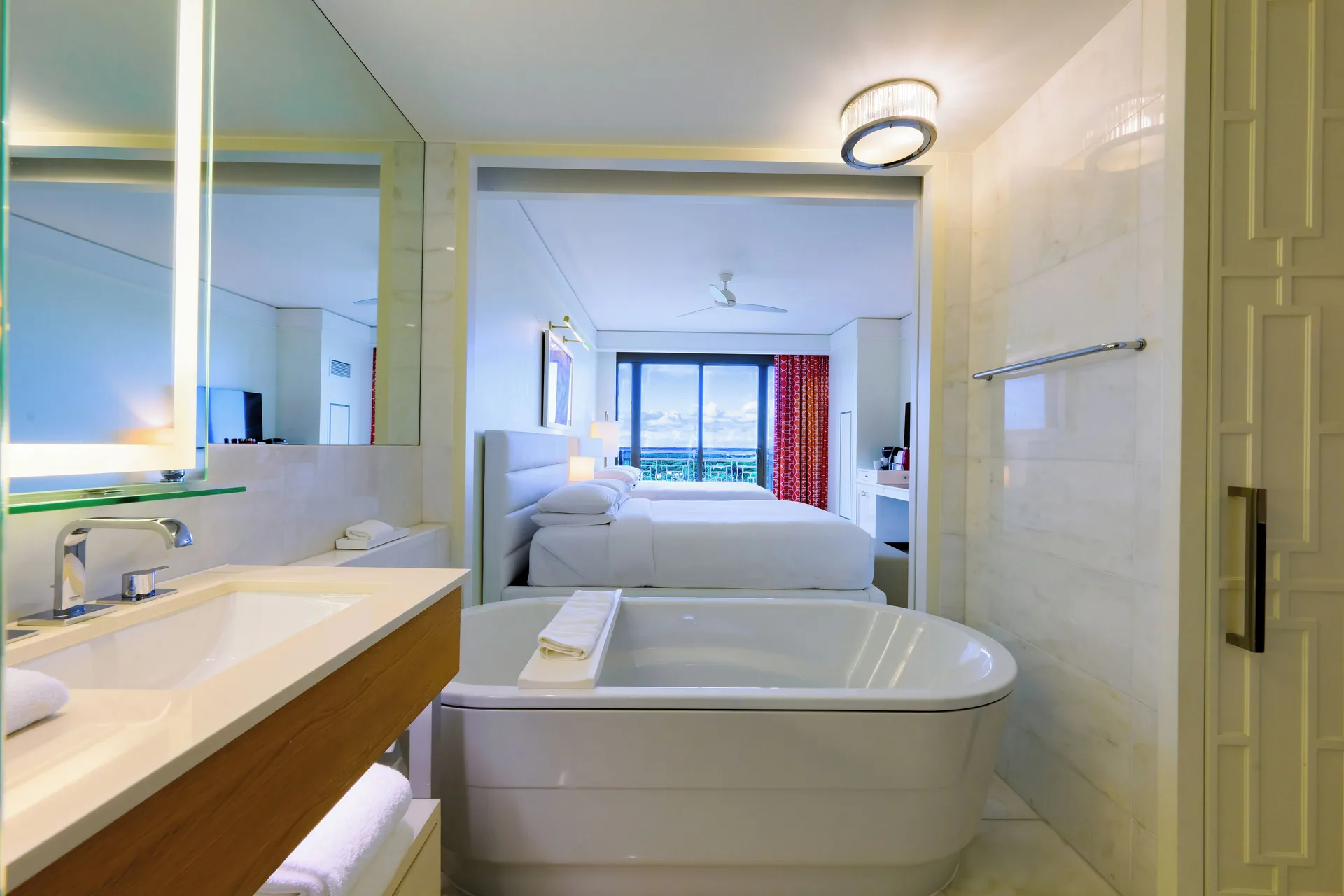 Fountain View Reserve bathroom and king bedroom at Grand Hyatt Baha Mar.