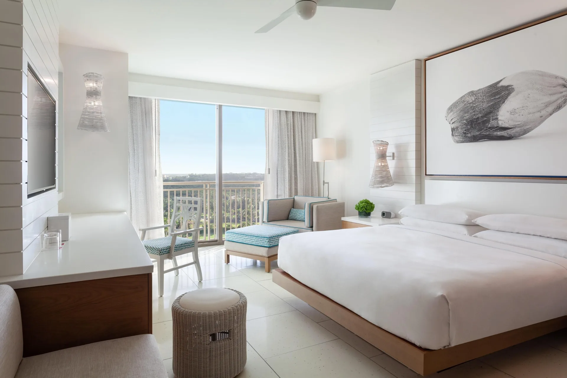 Fountain view king room with balcony, desk and seating at Grand Hyatt Baha Mar.