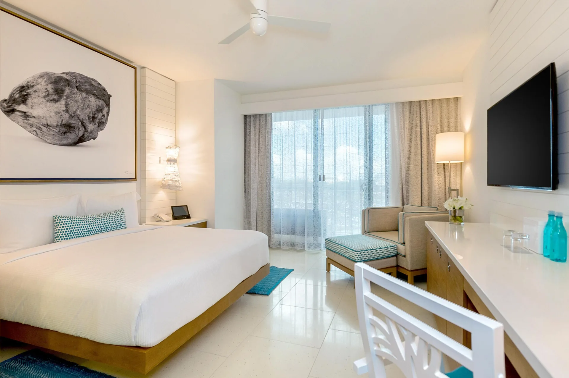 King bed room with desk, TV and seating area at Grand Hyatt Baha Mar.