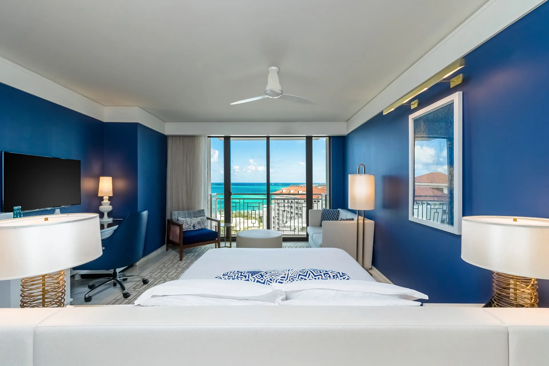 Ocean View king room with blue walls and balcony at Grand Hyatt Baha Mar.