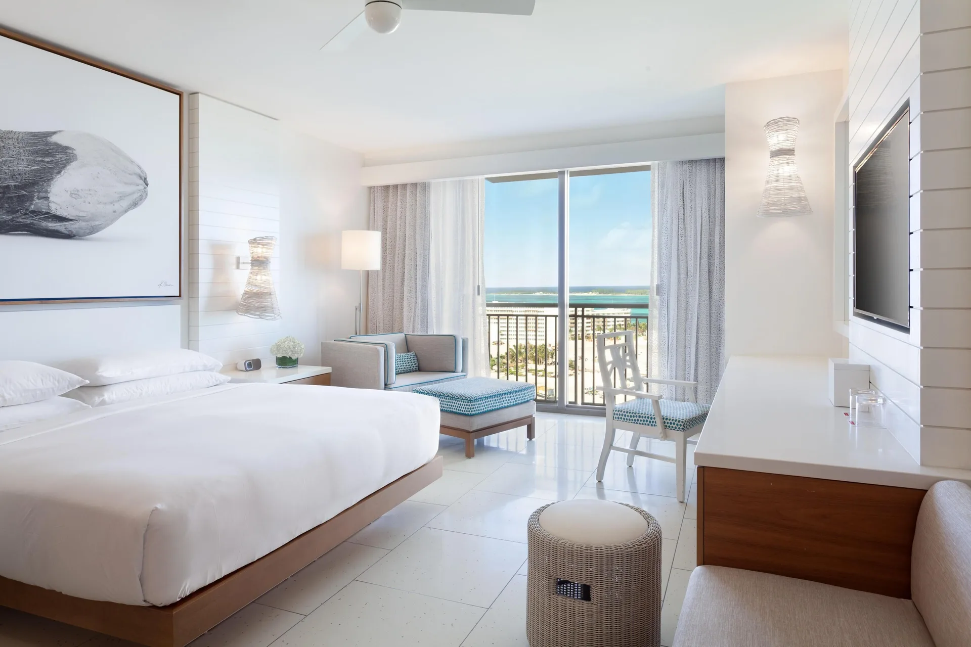 Ocean View king room with chaise, desk, and balcony at Grand Hyatt Baha Mar.