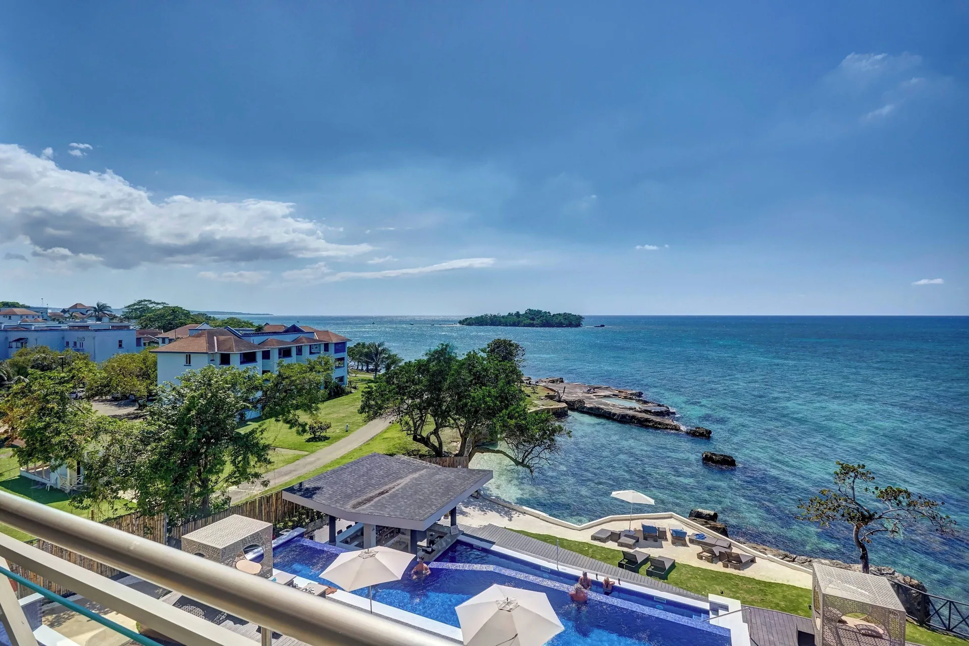 Oceanfront pool and coastline view at Grand Lido Negril Au-Naturel.