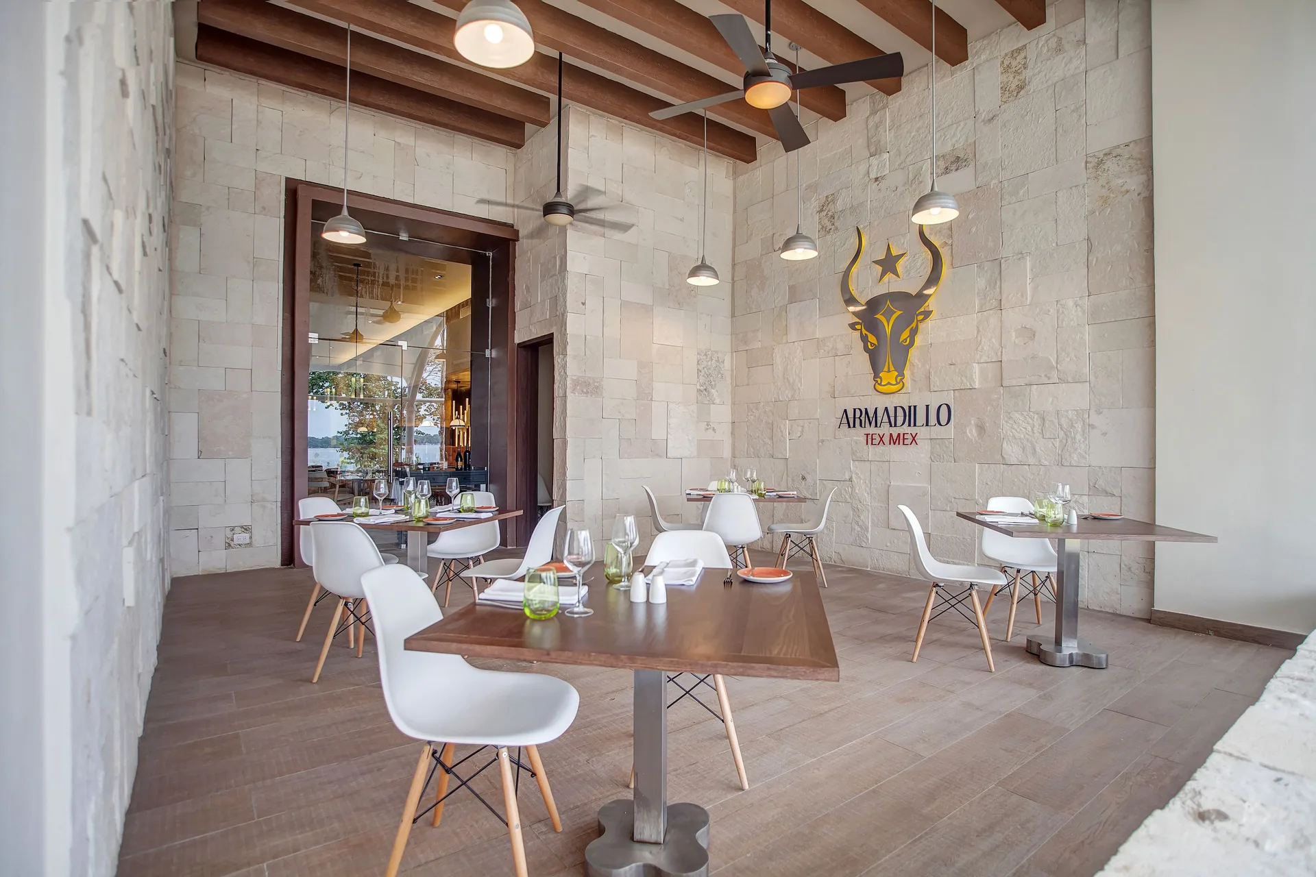 Armadillo Tex-Mex Cuisine dining room with white chairs at Grand Lido Negril Au-Naturel.