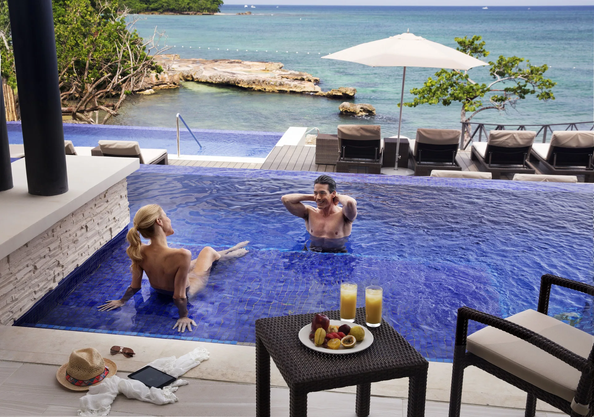 Sunset Swim Out Suite pool terrace with ocean view at Grand Lido Negril Au-Naturel.