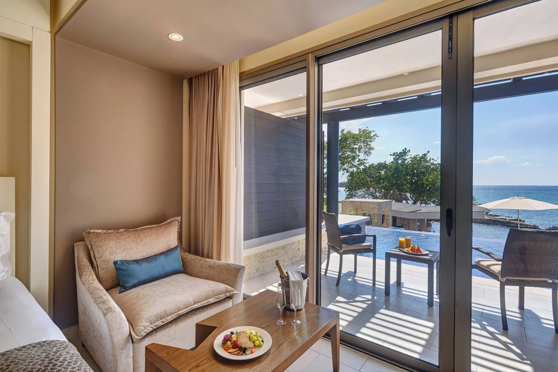 Sunset Swim Out Suite sitting area and swim-out terrace at Grand Lido Negril Au-Naturel.