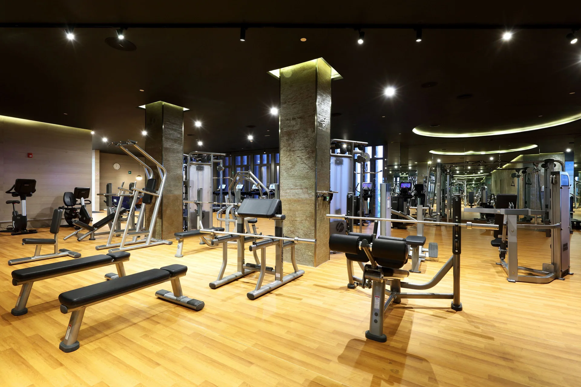 Weight machines and benches fill the gym at Grand Palladium Select Costa Mujeres.