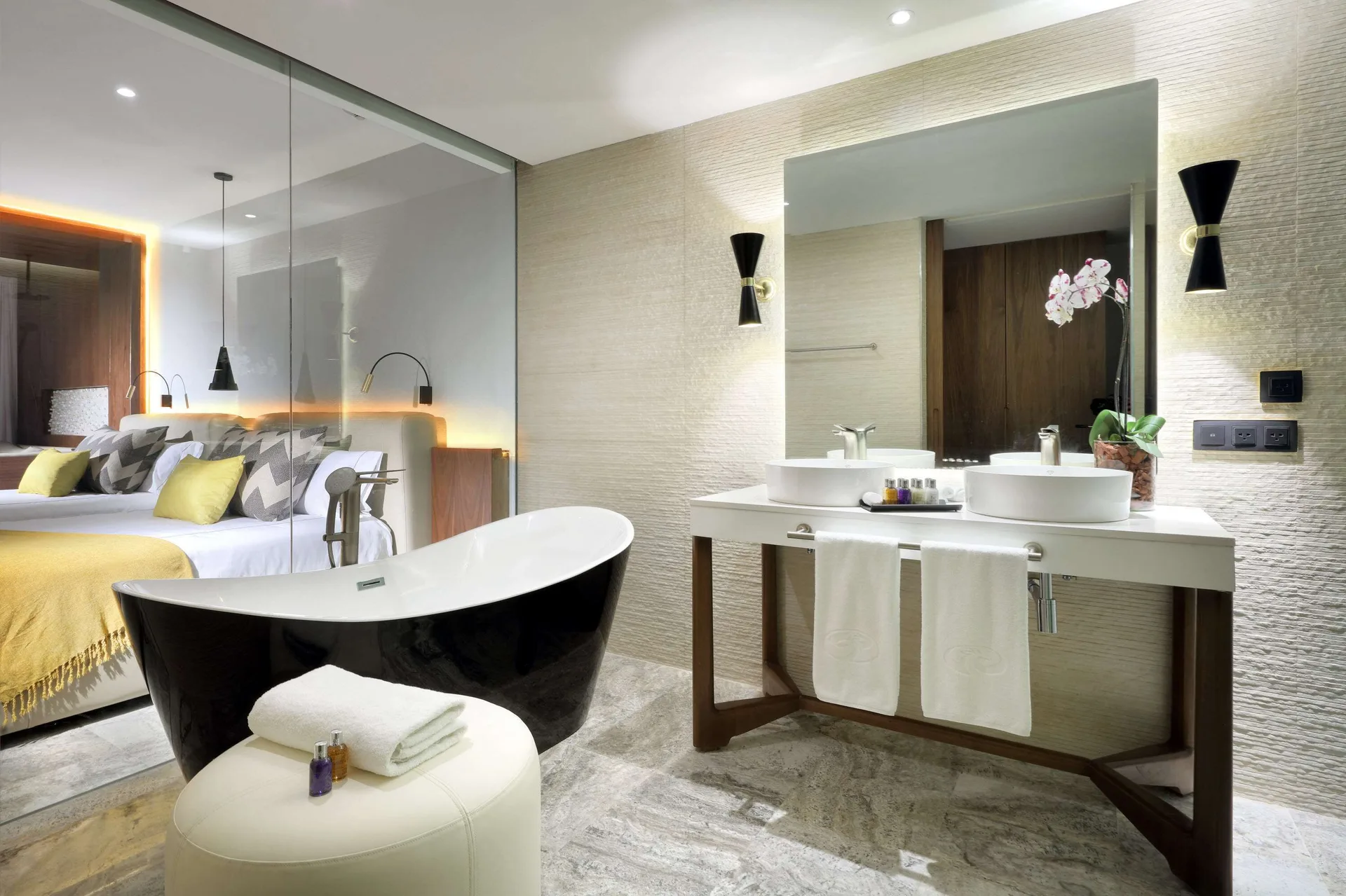 Junior Suite Pool Access bathroom and bedroom at Grand Palladium Select Costa Mujeres.