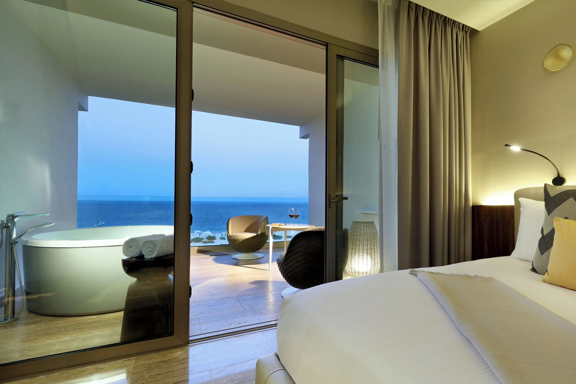 Loft Suite Jacuzzi Terrace bedroom and ocean terrace at Grand Palladium Select Costa Mujeres.