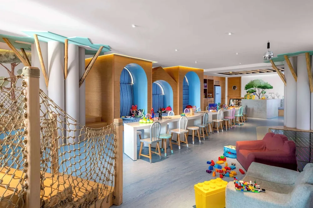 Colorful kids club playroom with toys and craft tables at Grand Velas Los Cabos.