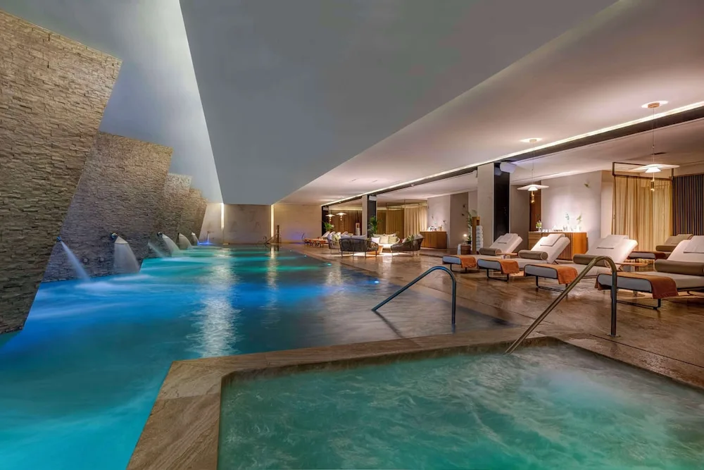 Spa hydrotherapy pool and whirlpool with loungers at Grand Velas Los Cabos.