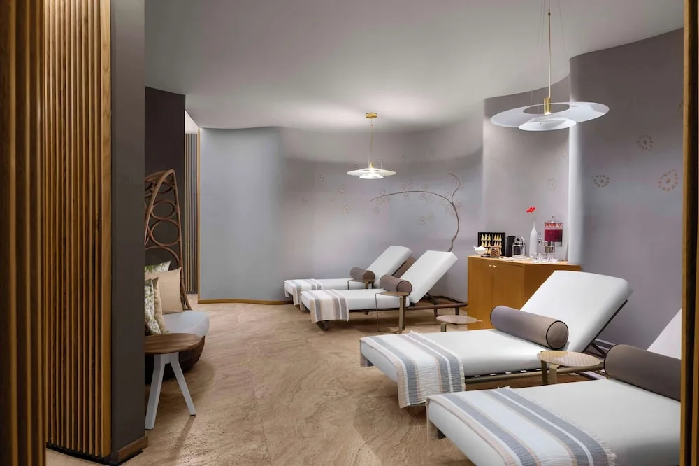 Spa relaxation room with chaise lounges and refreshments at Grand Velas Los Cabos.