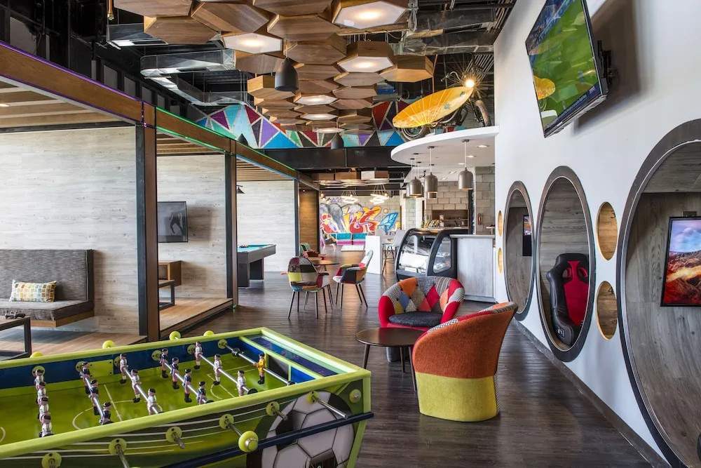 Foosball table and lounge chairs in the teen club at Grand Velas Los Cabos.