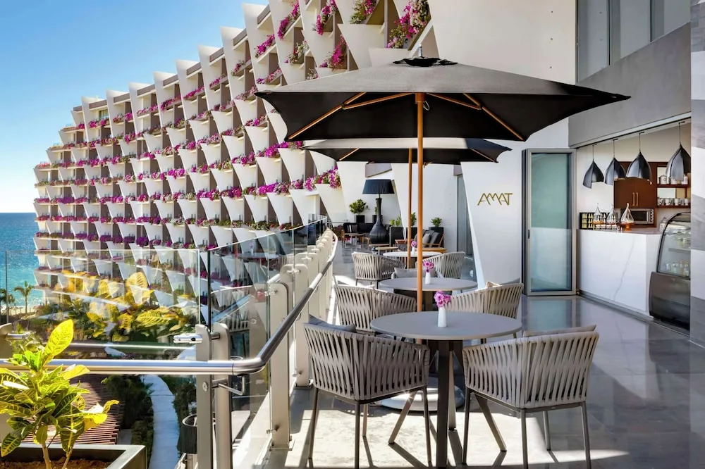 Terrace seating at Amat Café with ocean views at Grand Velas Los Cabos.