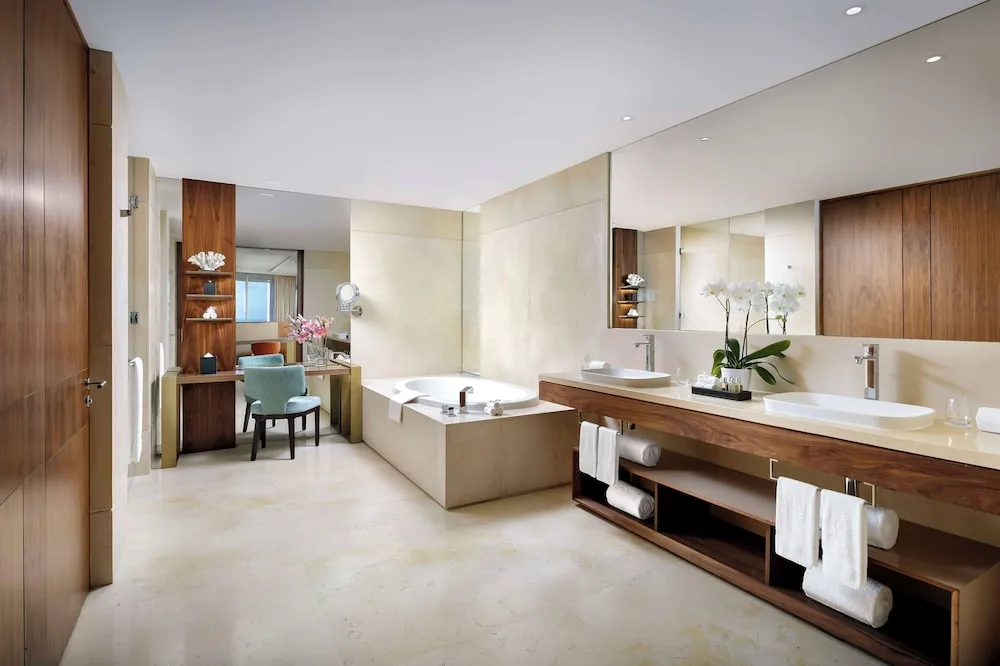 One Bedroom Governor Suite bathroom with soaking tub and double vanity at Grand Velas Los Cabos.