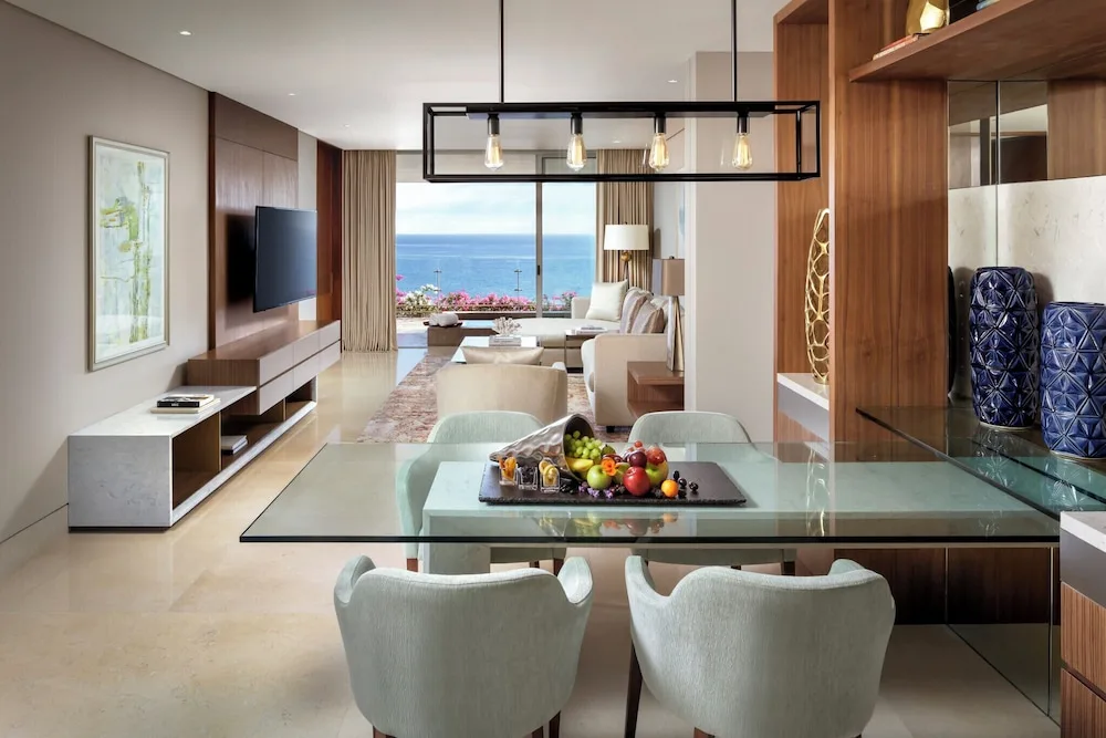 One Bedroom Governor Suite dining and living area with ocean view at Grand Velas Los Cabos.