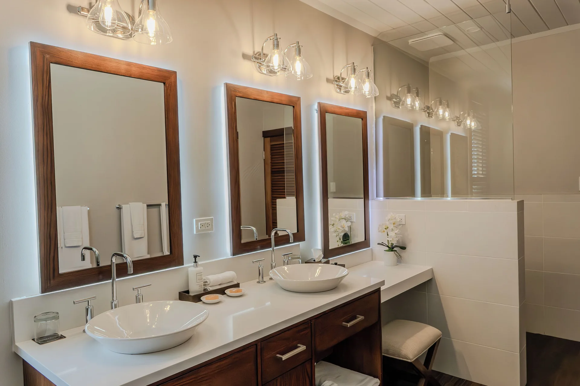 Signature Villa bathroom with dual sinks and lit mirrors at Hammock Cove Antigua.