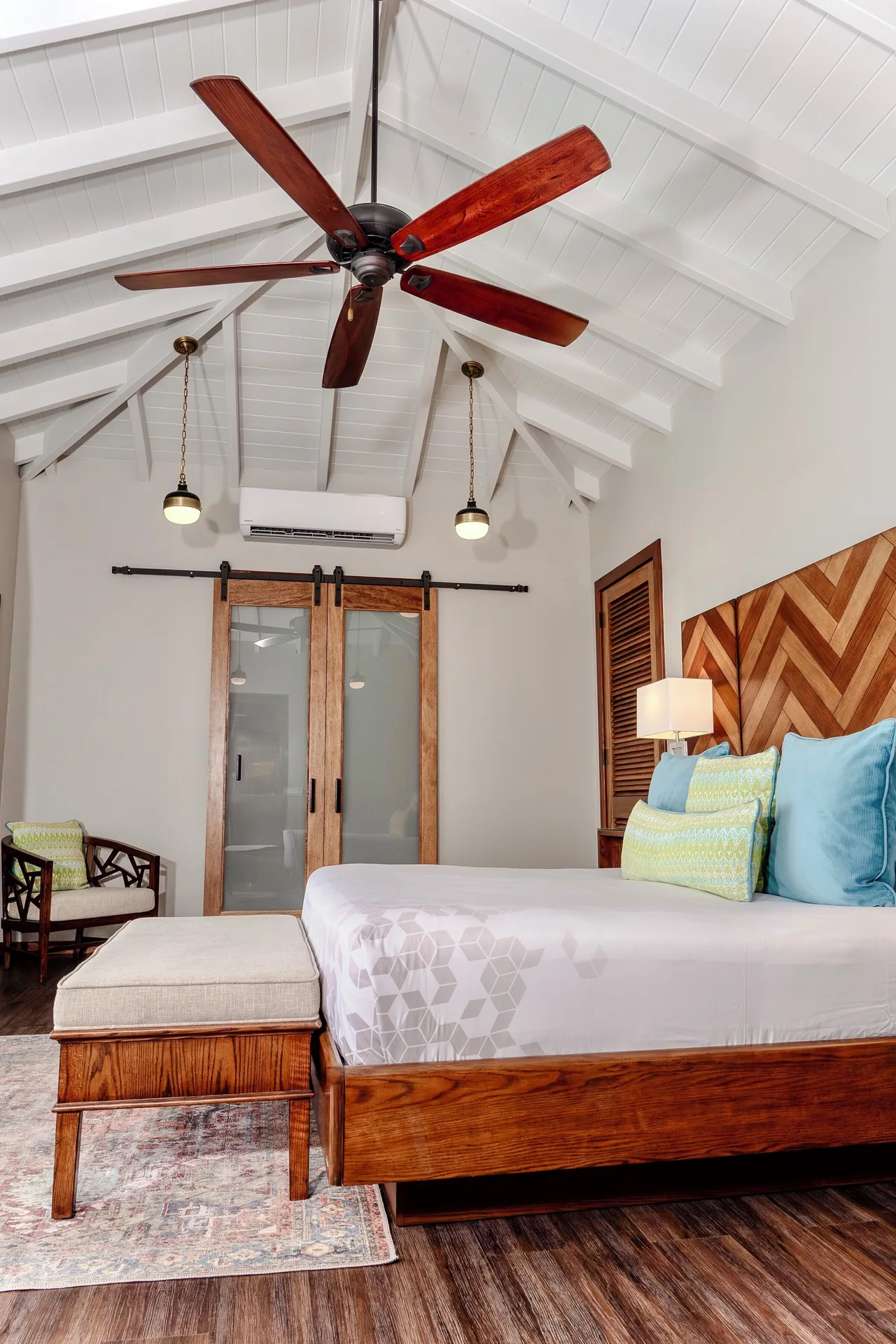 Signature Villa bedroom with king bed and vaulted ceiling at Hammock Cove Antigua.