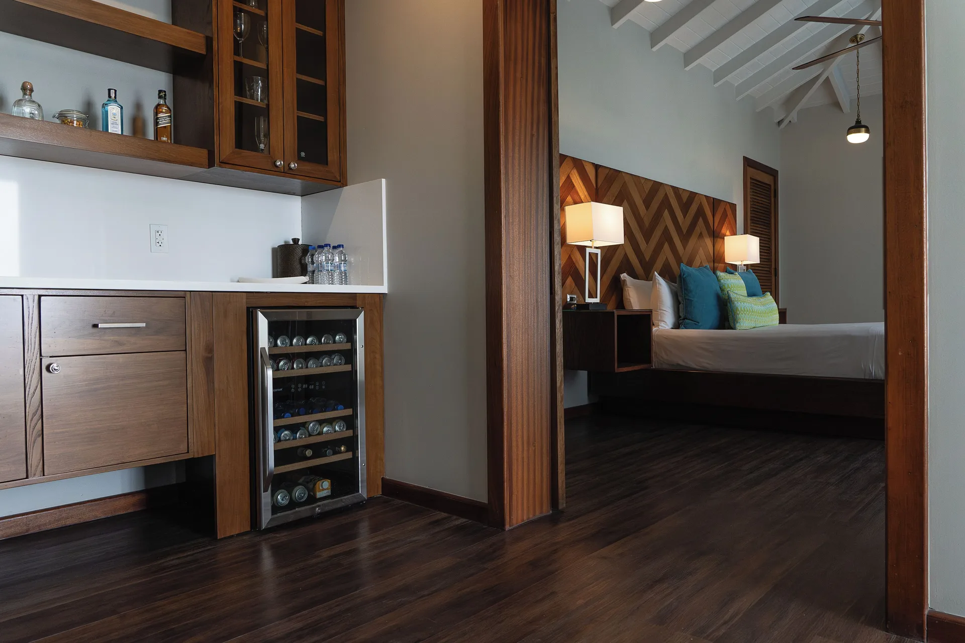 Signature Villa minibar area and king bedroom beyond at Hammock Cove Antigua.