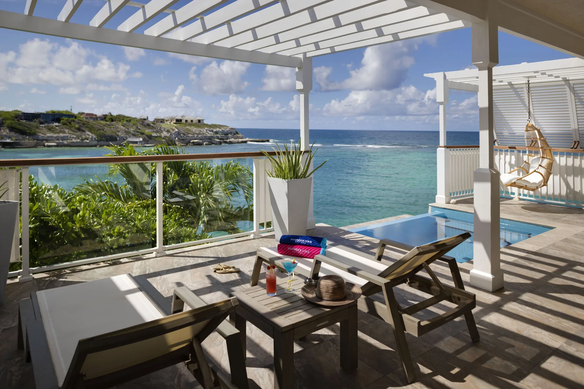 Waterfront Villa terrace with loungers and plunge pool at Hammock Cove Antigua.