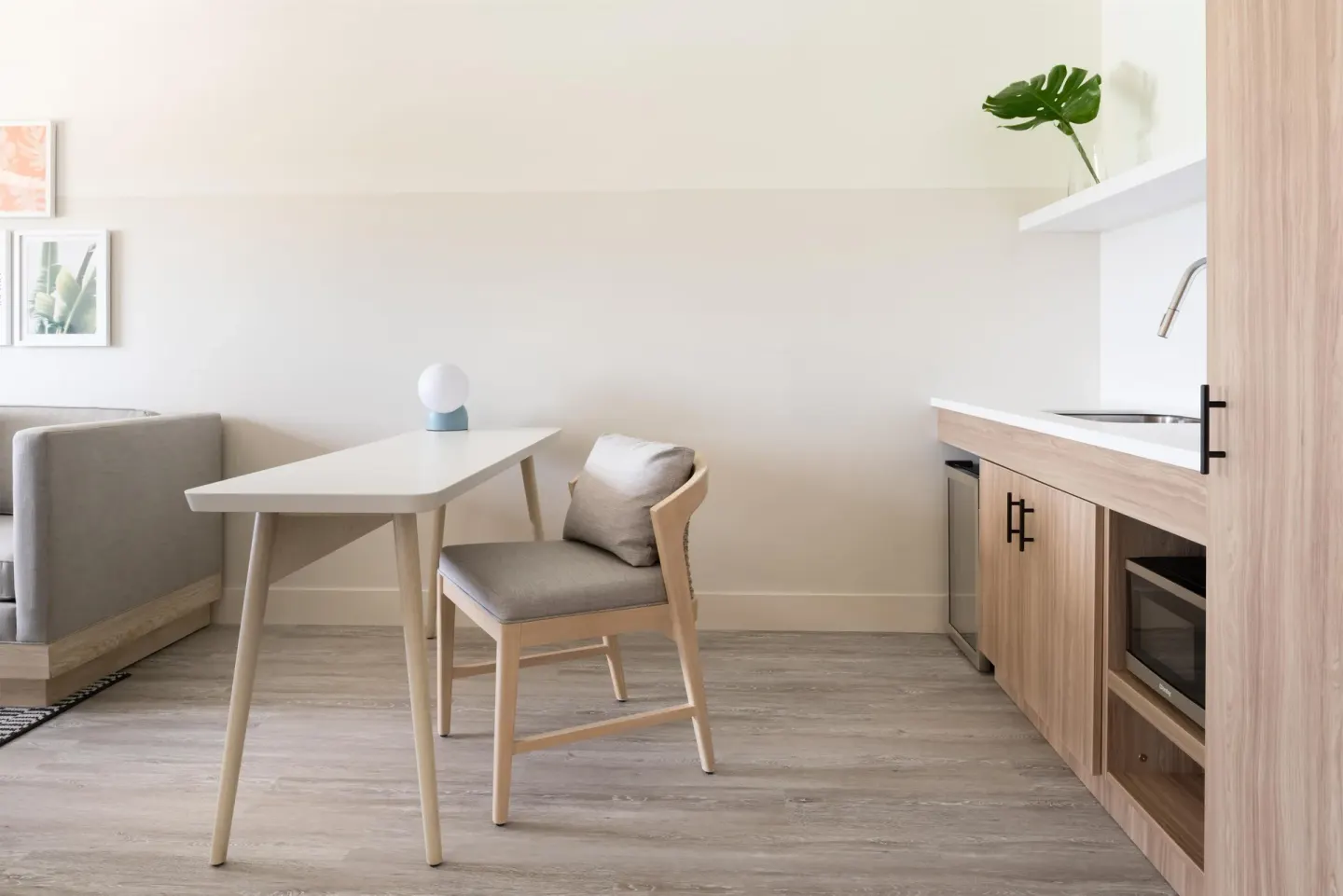 One Bedroom Suite kitchenette and dining table at Hampton by Hilton Grand Cayman Seven Mile Beach.