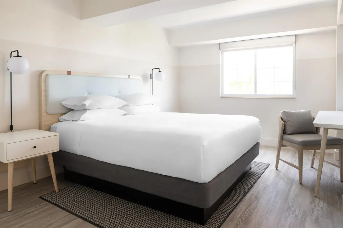 Standard Room partial ocean view king bed at Hampton by Hilton Grand Cayman Seven Mile Beach.