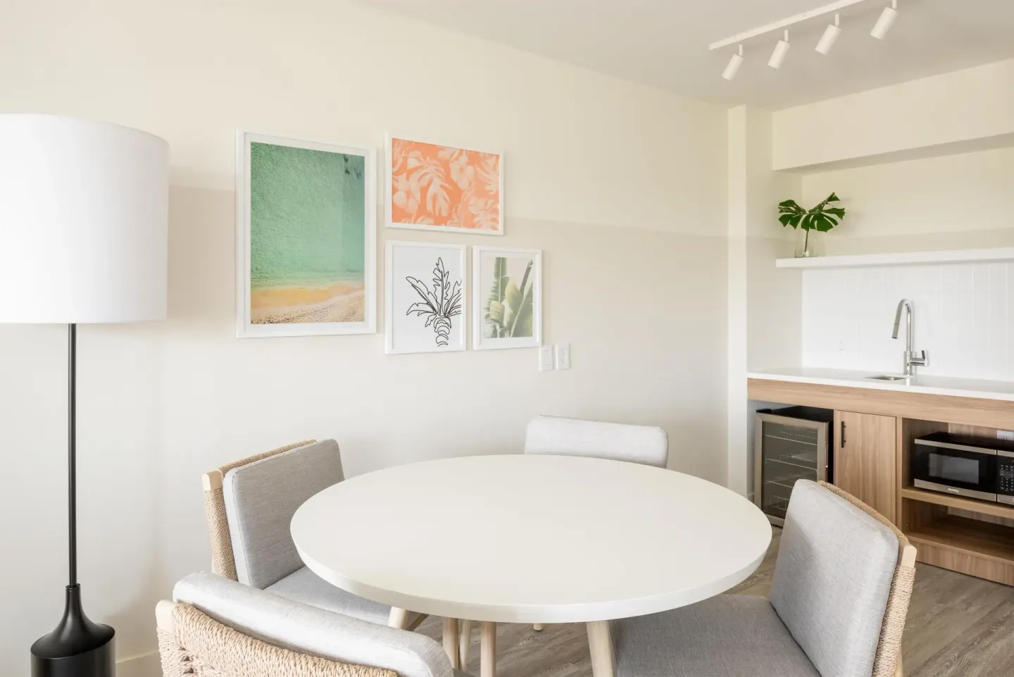 Standard room dining table and kitchenette at Hampton by Hilton Grand Cayman Seven Mile Beach.