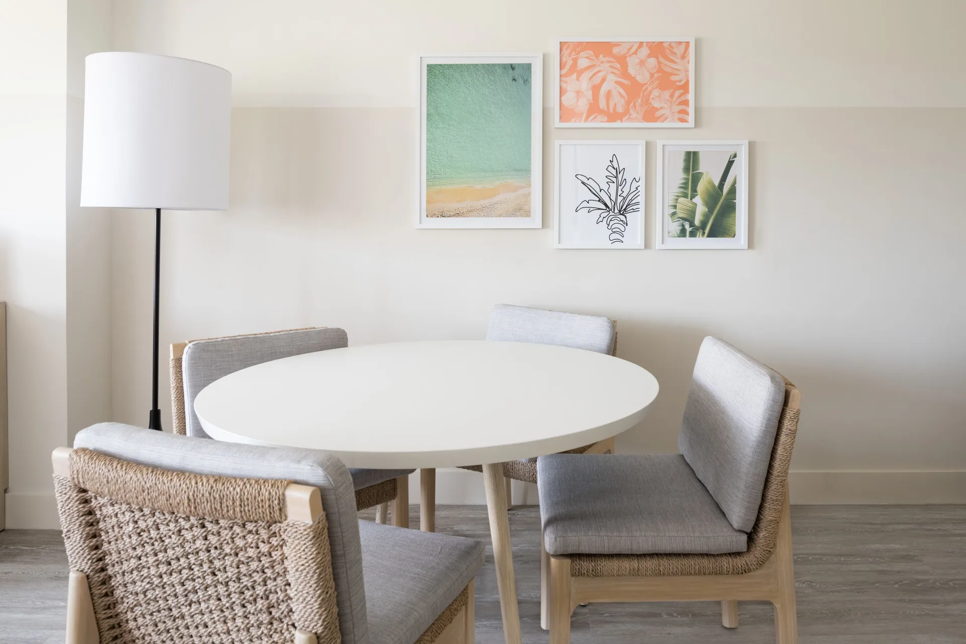 Standard room round table and wall art at Hampton by Hilton Grand Cayman Seven Mile Beach.