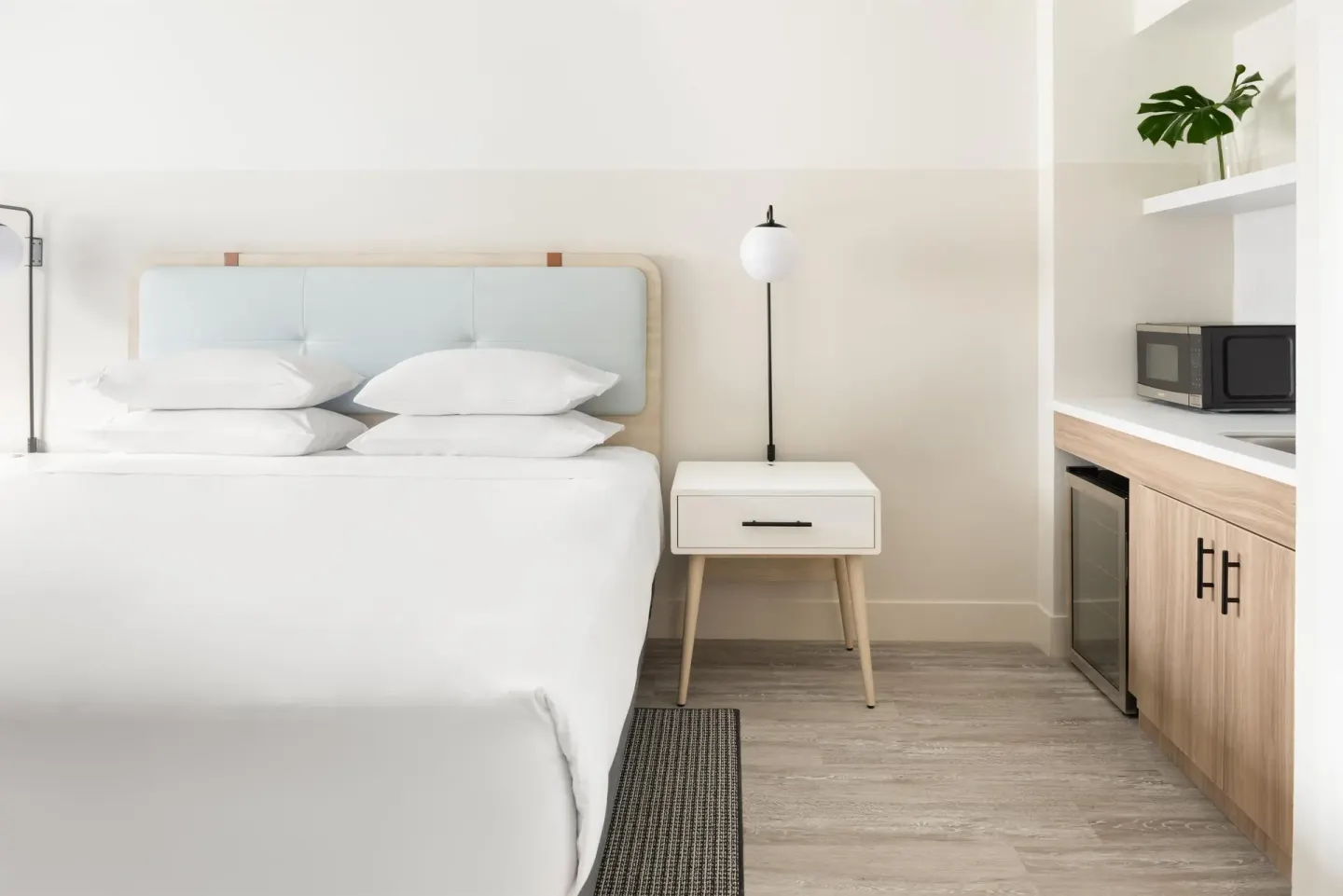 King bed and kitchenette details in an accessible studio at Hampton by Hilton Grand Cayman Seven Mile Beach.
