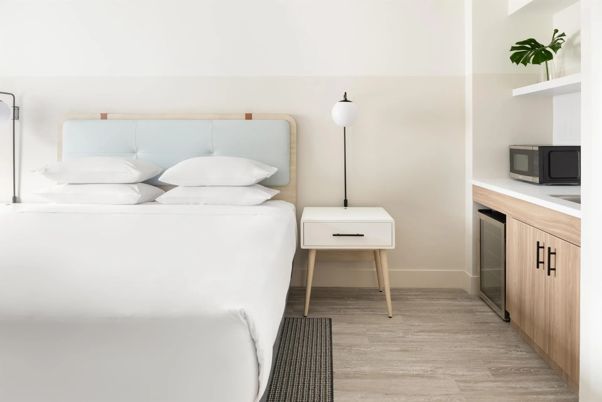 King bed and kitchenette details in an accessible studio at Hampton by Hilton Grand Cayman Seven Mile Beach.